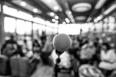 A microphone in sharp focus, the room behind it blurred